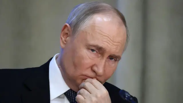 Є 